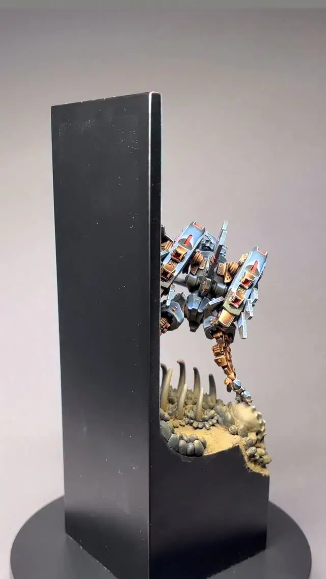 🌎 Tau Chromeander Farsight 🌎
I'm excited to share a closer look at my modified Commander Farsight base, which I re-entered into the Golden Demons 2025 Open Competition Category at Spiel in Essen. Painting the backdrop and designing the base was a significant challenge, but it paid off with a notable entry - my second for this model!
One area I struggle with in competition pieces is basing, but even with time constraints, I'm proud of how this base pushed my skills. I'll focus on sharing my knowledge, mistakes, and growth in future videos and projects.
🙌Feel free to share your thoughts on the base!

#warhammerofficial #tau #warhammer #warhammer40k #nmm #nonmetallicmetal #paintingminiatures #miniaturepainting  #paintingwarhammer #hobbyfriday #xenos #wh40k #chrome #artist #art #mech #goldendemon