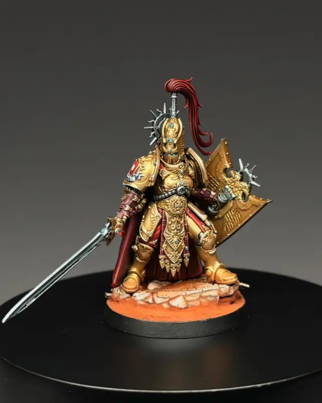 ⚔️ New Custodes Shield‑Captain, new TMM era. 

I absolutely love the female sculpt GW dropped — and she became the perfect testbed to finally upgrade my 2‑year‑old Custodes TMM guide.

This time I pushed myself: ultra‑thin metallic layers, no masking, cleaner transitions… and after stripping the mini once, a new Gaahleri airbrush metallic finally cracked the code.

Drybrush armor, deepen the shades, refine the details — and suddenly this became my best TMM Custodes yet. Super simple, super repeatable.
I’ll release this as a 2‑part guide again:

1️⃣ Armor TMM 
2️⃣ Cloak, leather, gems & details

What would you like to see me focus on most in the new guide — the armor workflow or the detail work?

#warhammer #warhammer40k #horusheresy #warhammercommunity #paintingwarhammer