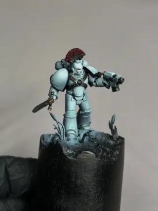 🚧 W.I.P. Wednesday 🚧

Something new is taking shape... 👀

I’ve finally started working on one of the new MK IV Armor from the upcoming Maximus Battle Group, and this project is already becoming much more than „just“ another miniature.

This time, I wanted to capture the atmosphere of the swamps of Davin with a small scenic base, creating a setting that tells part of the story before a single brushstroke reaches the miniature.

The Luna Wolves iconic white armour will stay true to the Luna Wolves, but I’m experimenting with a very subtle twist by mixing just a tiny touch of AK Dark Blue Grey into the base colour. The result is a soft grey-blue-green hue—not enough to change the character of the armour, but just enough to hint at what was yet to come.

The miniature itself is starting to take shape, although there are still several highlight layers, details and finishing touches to add. The base is coming together nicely as well, and I’m really enjoying exploring a more narrative approach for this project.

A huge thank you to @oliver_spaeth for sharing his knowledge and for the lessons on scenic basing. Those conversations definitely encouraged me to push this project further than I normally would. 🙏

I have a few more ideas planned for this one, but I’ll keep those under wraps for now... 😉

So, what do you think is coming? And would you like to see more behind-the-scenes updates as this project develops?

#warhammer #horusheresy #paintingwarhammer #warhammer40k #warhammercommunity